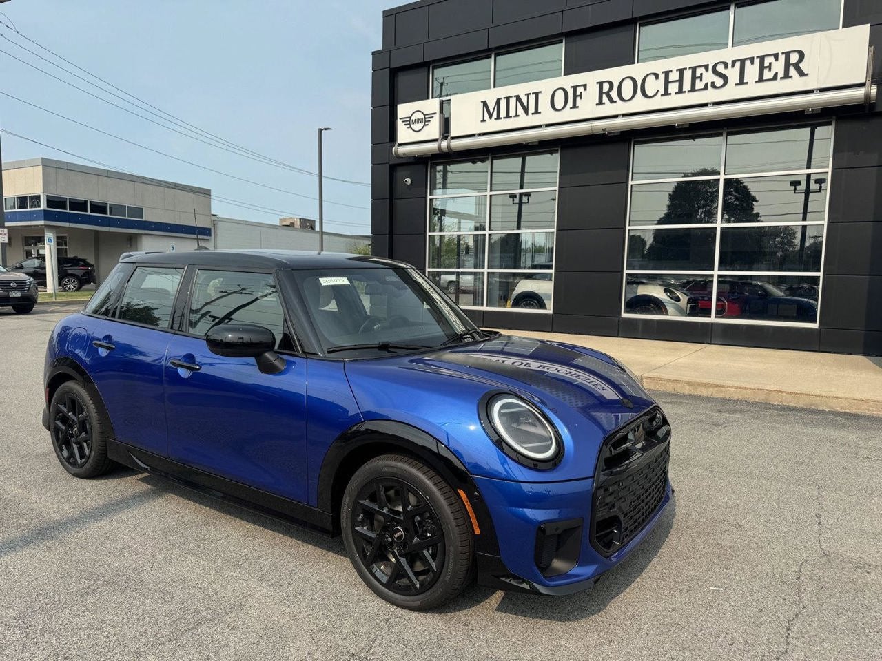 2026 MINI 4 DOOR ICONIC in Blazing Blue Metallic — front three-quarter view