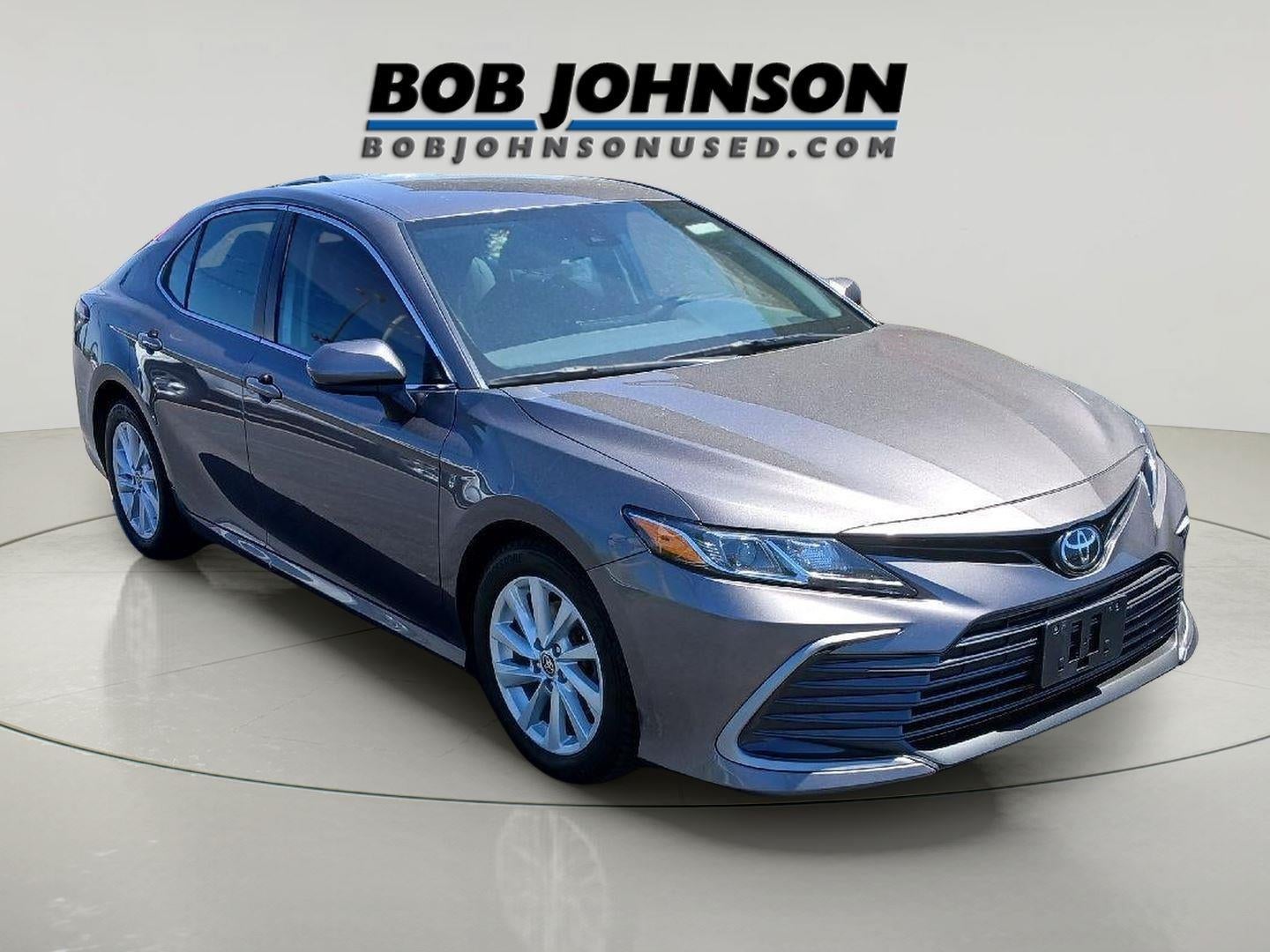 2023 Toyota Camry LE in Predawn Gray Mica — front three-quarter view