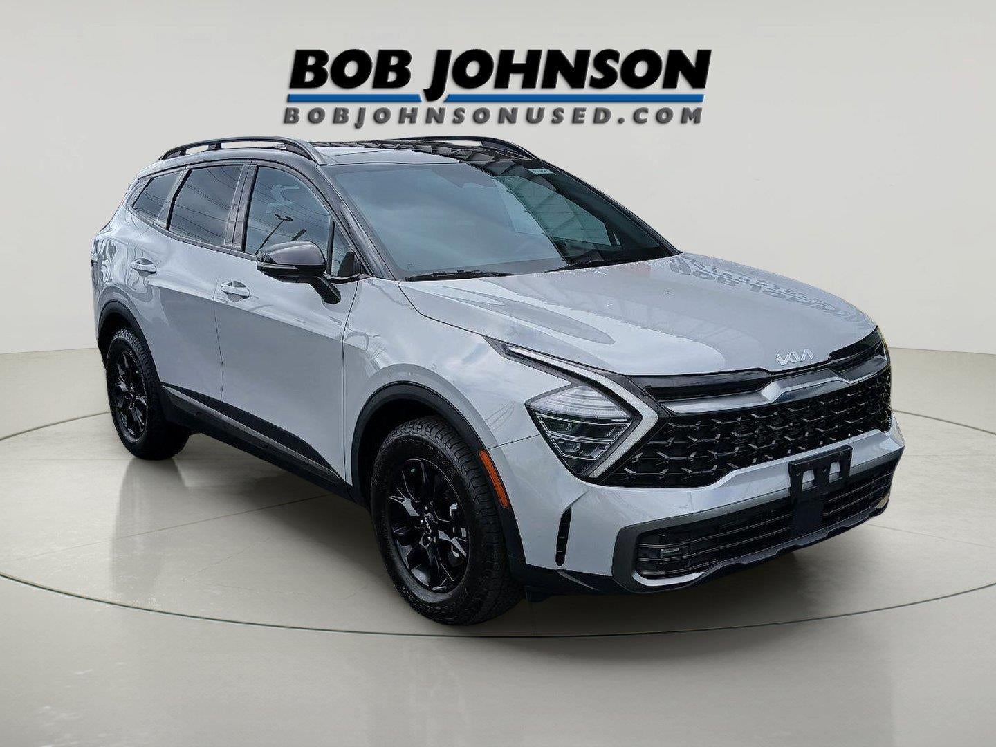2024 Kia Sportage X-Pro in Wolf Gray/Ebony Black Roof — front three-quarter view