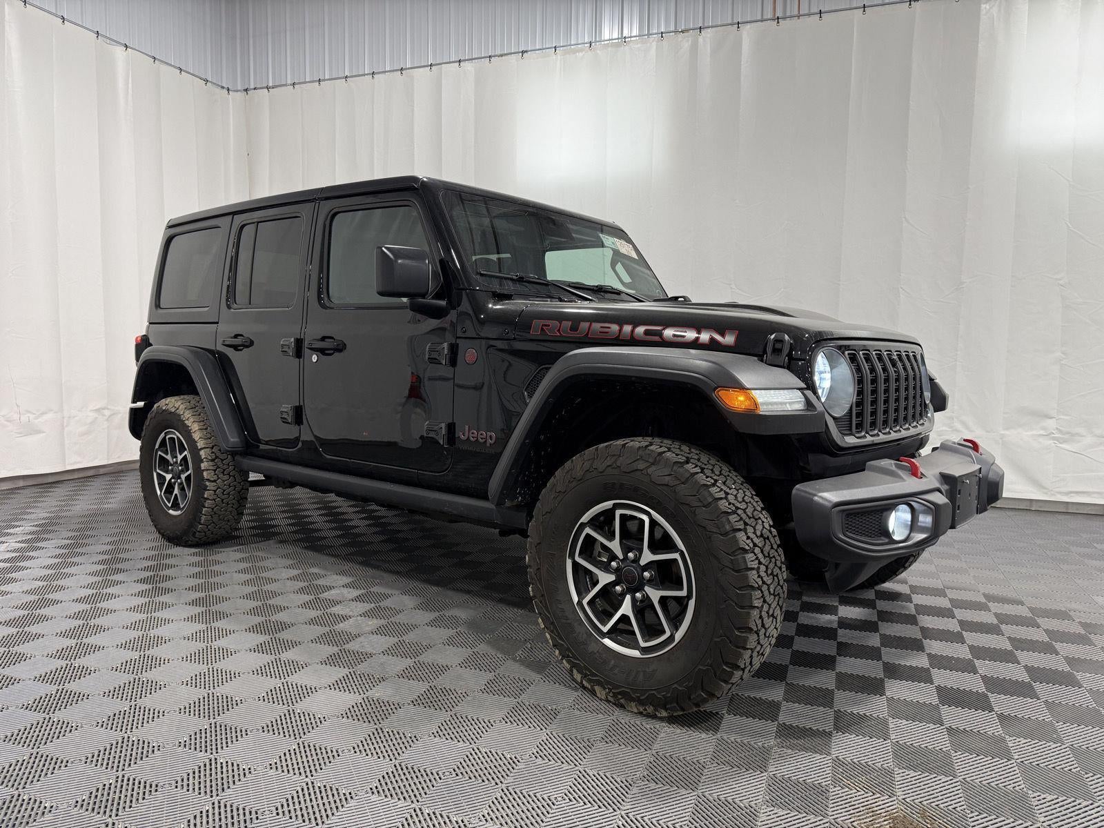 2024 Jeep Wrangler 4-Door Rubicon in Black — front three-quarter view