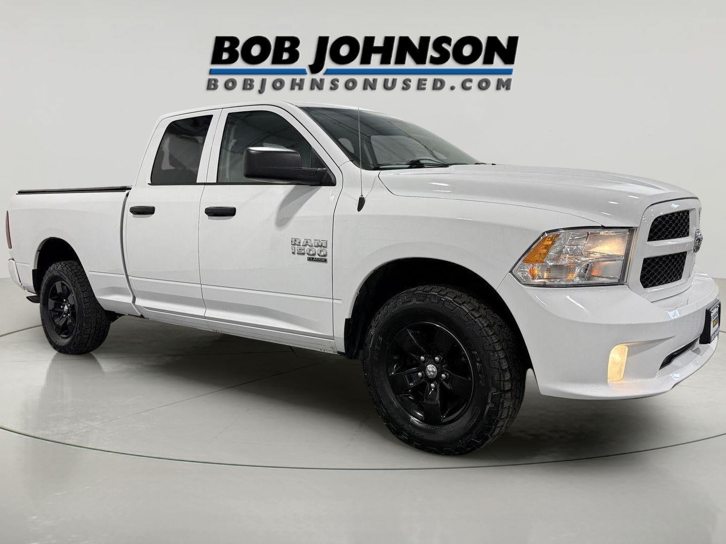 2019 RAM 1500 Classic Express Quad Cab 4x4 6'4' Box in Bright White Clearcoat — front three-quarter view