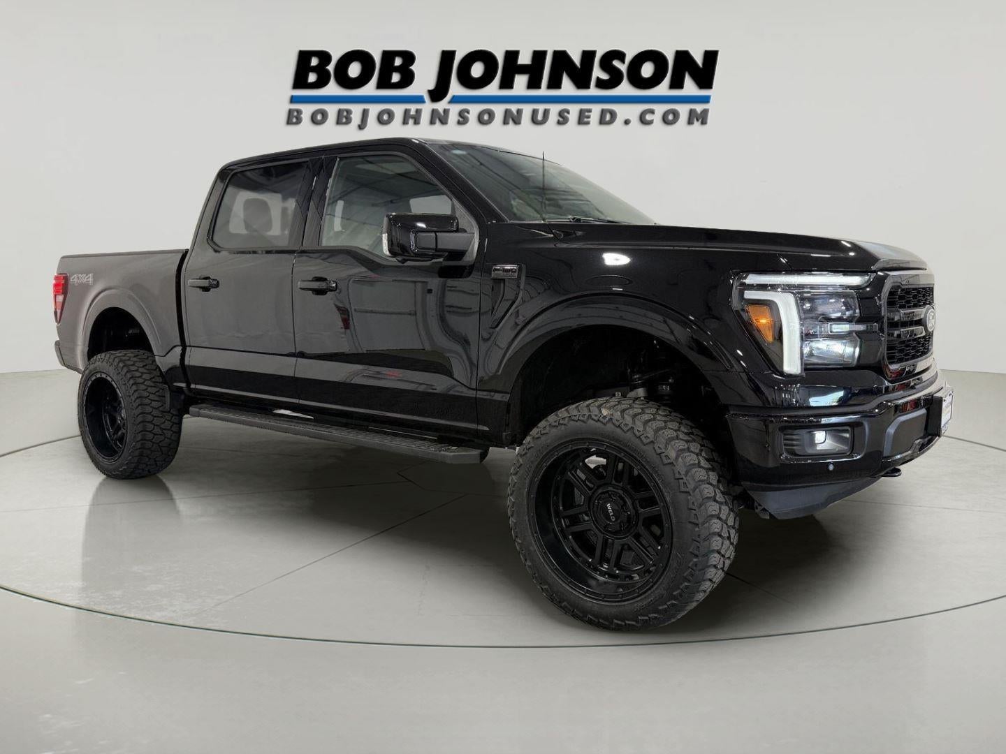 2026 Ford F-150 LARIAT in Agate Black — front three-quarter view