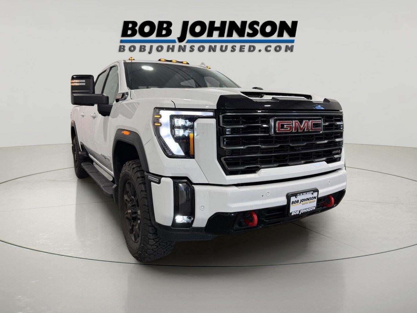 2024 GMC Sierra 2500HD AT4 in Summit White — front three-quarter view