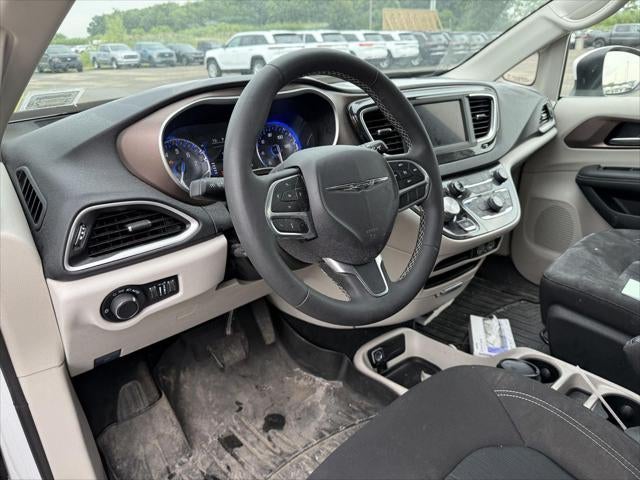 2023 Chrysler Voyager — rear three-quarter view