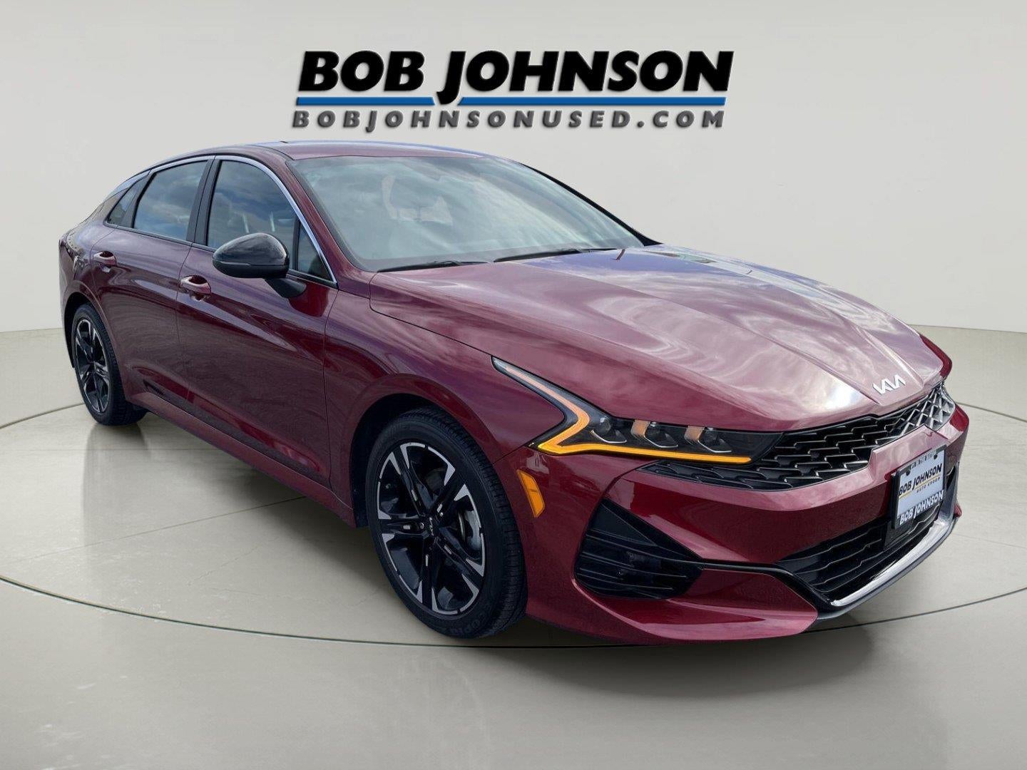 2024 Kia K5 GT-Line in Passion Red Tintcoat — front three-quarter view