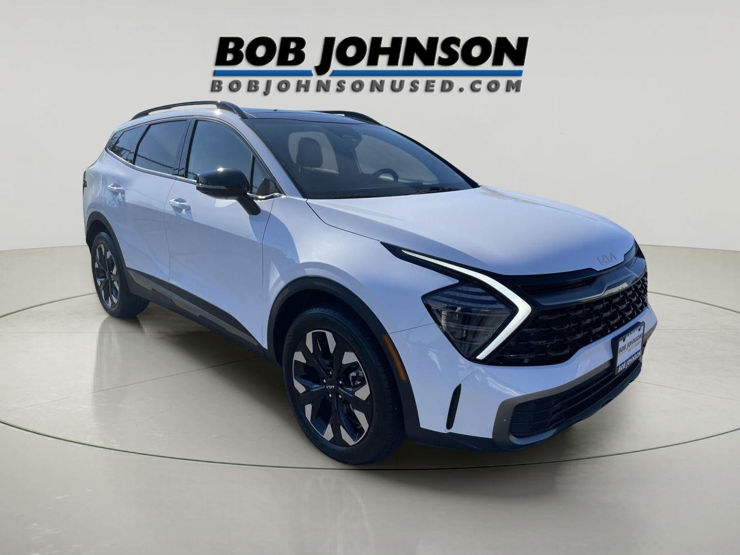 2024 Kia Sportage X-Line in Glacial White Pearl — front three-quarter view