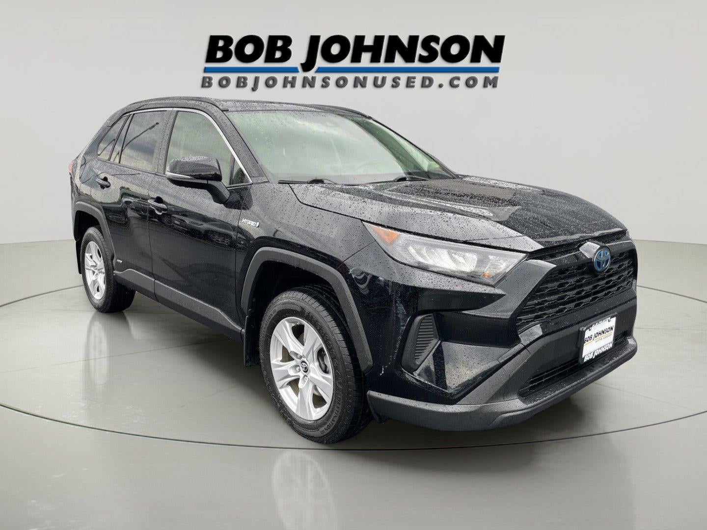 2019 Toyota RAV4 Hybrid LE in Midnight Black Metallic — front three-quarter view
