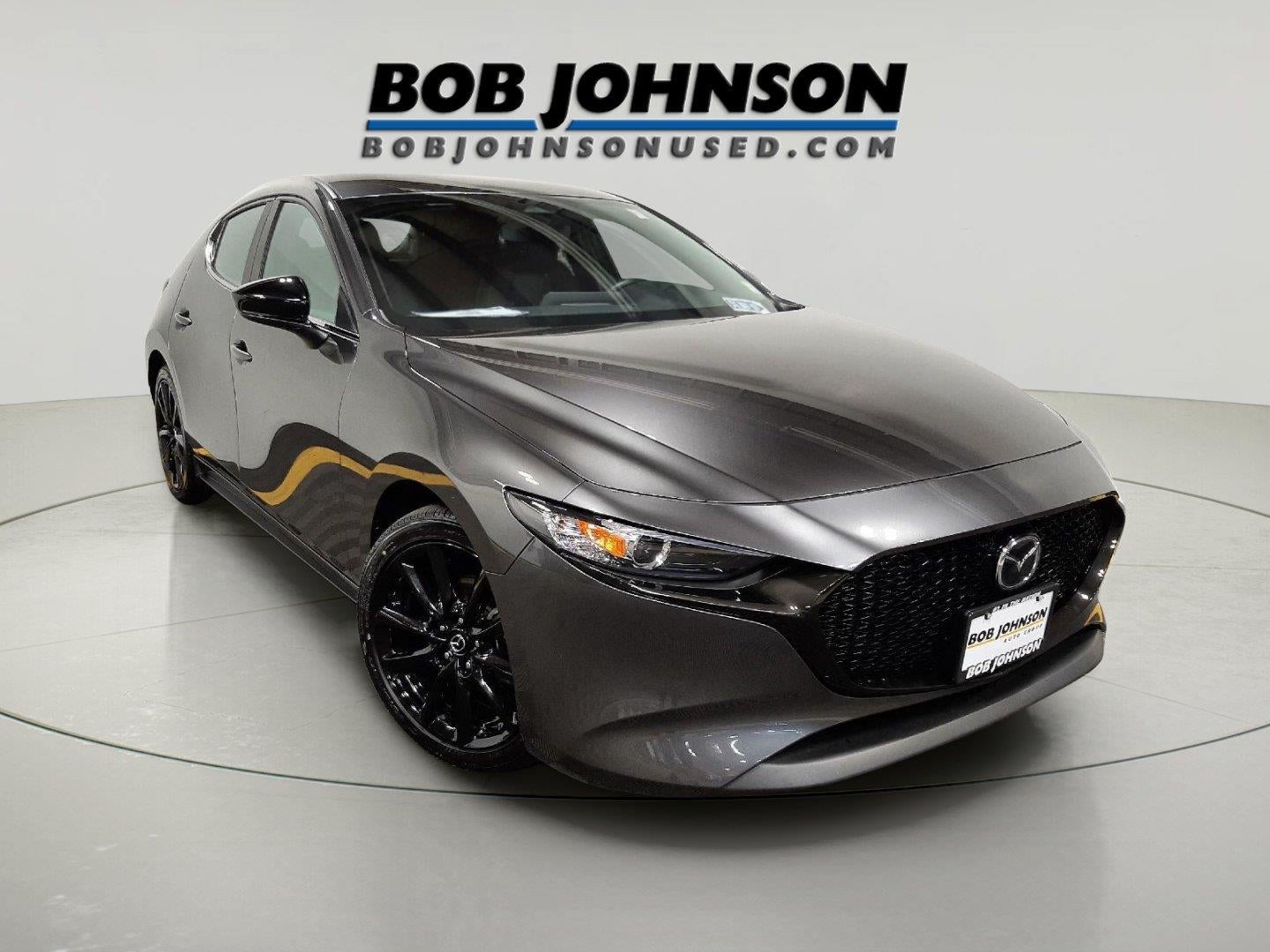 2024 Mazda Mazda3 Hatchback 2.5 S Select Sport in Machine Gray Metallic — front three-quarter view