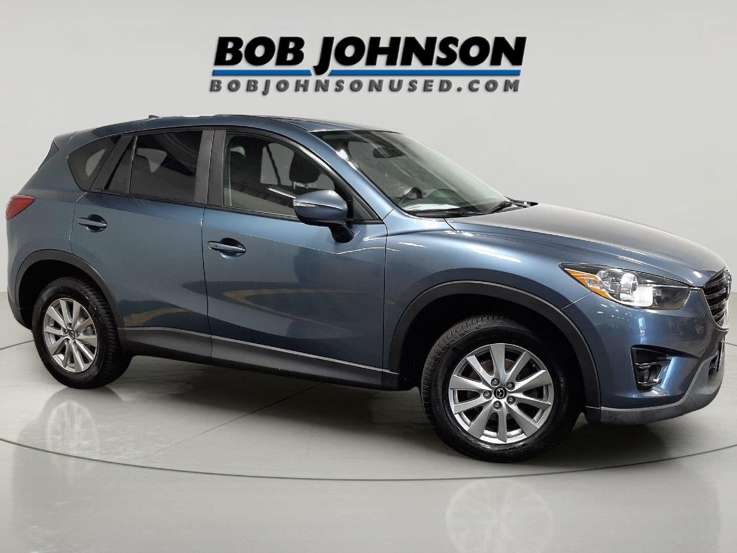 2016 Mazda Mazda CX-5 Touring in Blue Reflex Mica — front three-quarter view